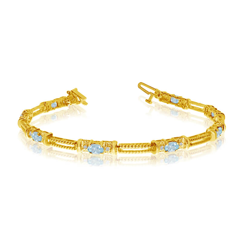 JCX3362: This 14k yellow gold natural aquamarine and diamond tennis bracelet features 8 oval aquamarines with a total gem weight of 1.12 carats and a total diamond weight of 0.16 carats.