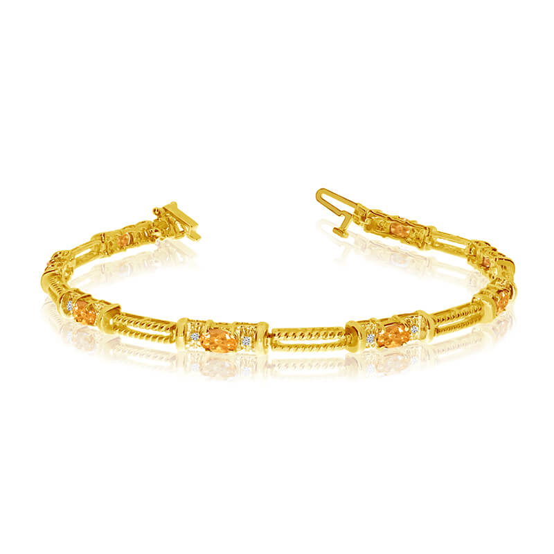 JCX3368: This 14k yellow gold natural citrine and diamond tennis bracelet features 8 oval citrines with a total gem weight of 1.2 carats and a total diamond weight of 0.16 carats.