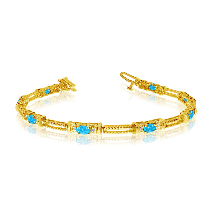 JCX3369: This 14k yellow gold natural blue-topaz and diamond tennis bracelet features 8 oval blue-topazs with a total gem weight of 1.52 carats and a total diamond weight of 0.16 carats.