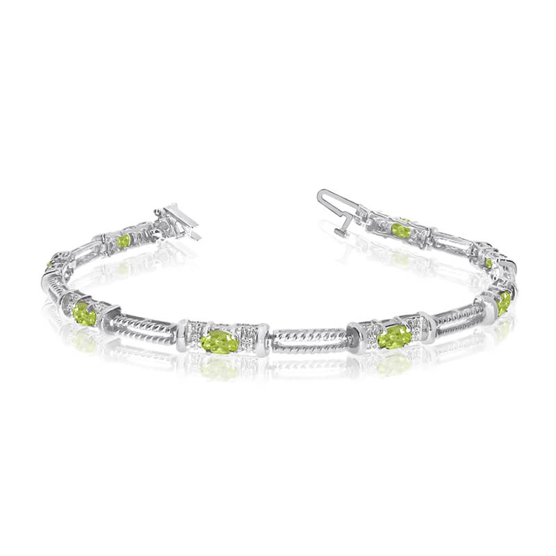 JCX3377: This 14k white gold natural peridot and diamond tennis bracelet features 8 oval peridots with a total gem weight of 1.52 carats and a total diamond weight of 0.16 carats.