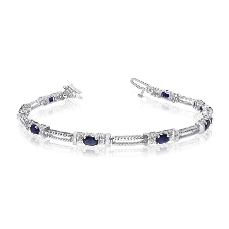 JCX3378: This 14k white gold natural sapphire and diamond tennis bracelet features 8 oval sapphires with a total gem weight of 2 carats and a total diamond weight of 0.16 carats.