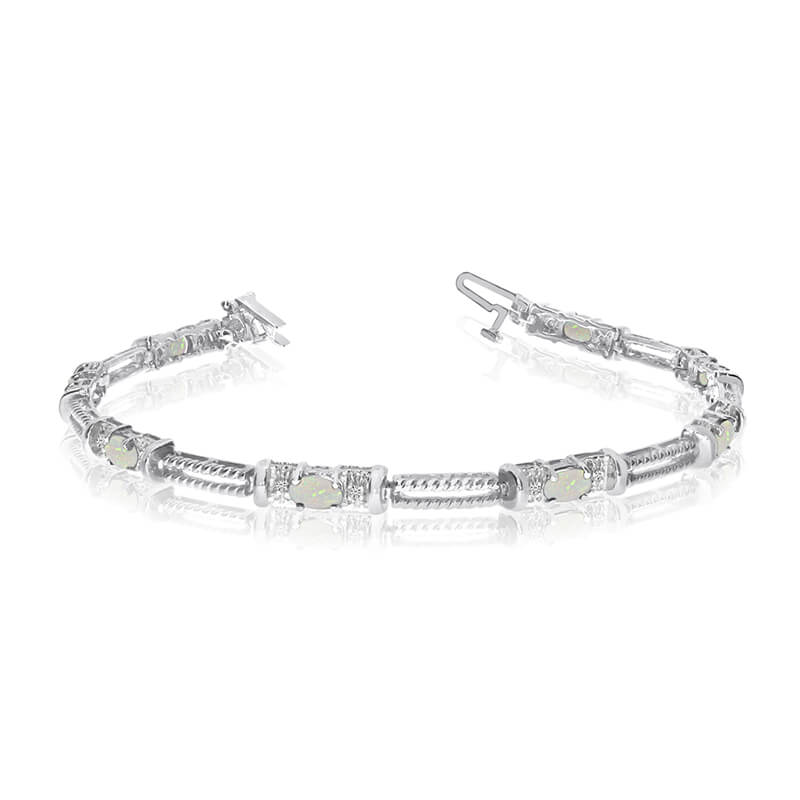 JCX3379: This 14k white gold natural opal and diamond tennis bracelet features 8 oval opals with a total gem weight of 0.64 carats and a total diamond weight of 0.16 carats.