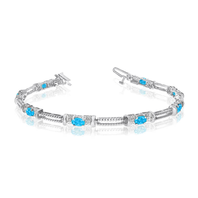 JCX3381: This 14k white gold natural blue-topaz and diamond tennis bracelet features 8 oval blue-topazs with a total gem weight of 1.52 carats and a total diamond weight of 0.16 carats.