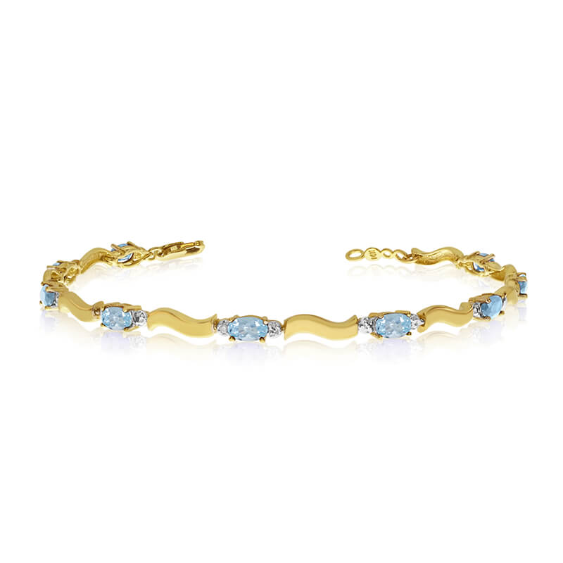 JCX3388: This 10K Yellow Gold oval aquamarine and diamond bracelet features nine 5x3 mm stunning natural aquamarine stones with a 1.8 ct total gem weight.