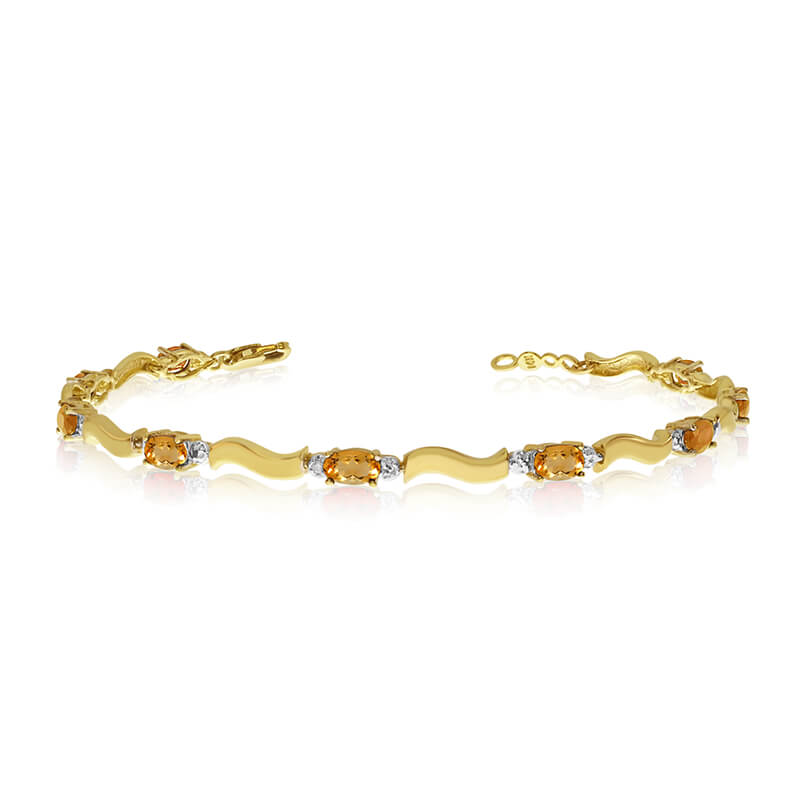 JCX3393: This 10K Yellow Gold oval citrine and diamond bracelet features nine 5x3 mm stunning natural citrine stones with a 2.07 ct total gem weight.