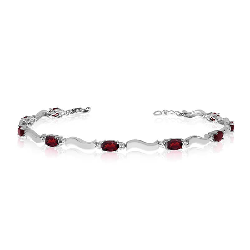JCX3395: This 10K White Gold oval garnet and diamond bracelet features nine 5x3 mm stunning natural garnet stones with a 2.25 ct total gem weight.