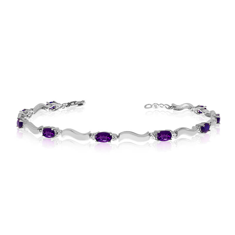 JCX3396: This 10K White Gold oval amethyst and diamond bracelet features nine 5x3 mm stunning natural amethyst stones with a 2.07 ct total gem weight.