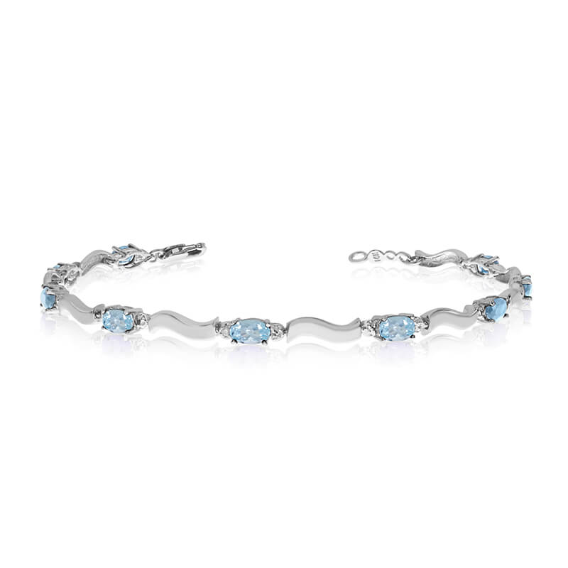 JCX3397: This 10K White Gold oval aquamarine and diamond bracelet features nine 5x3 mm stunning natural aquamarine stones with a 1.8 ct total gem weight.