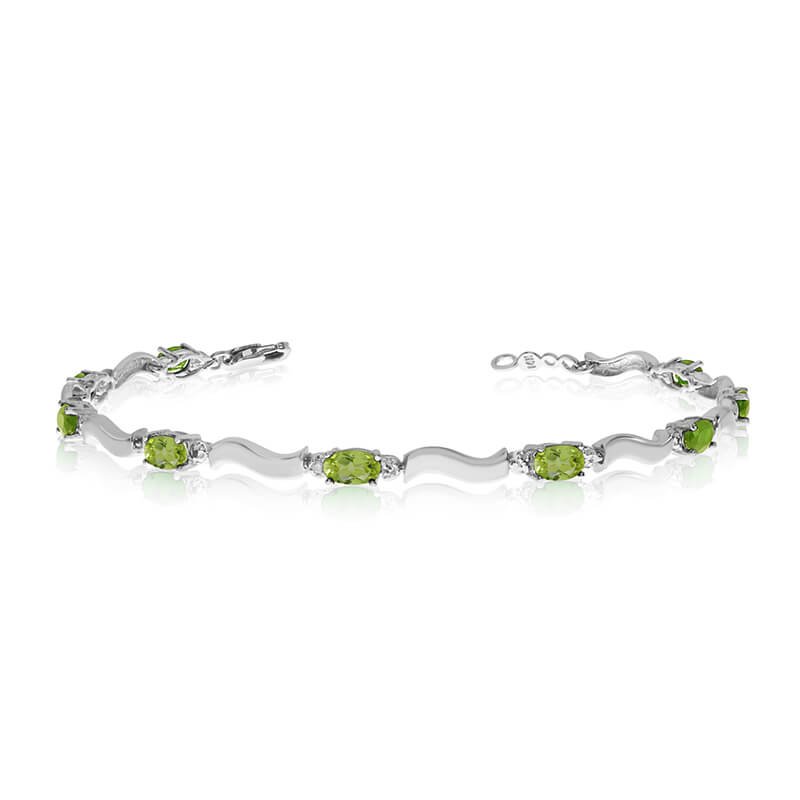 JCX3400: This 10K White Gold oval peridot and diamond bracelet features nine 5x3 mm stunning natural peridot stones with a 2.52 ct total gem weight.