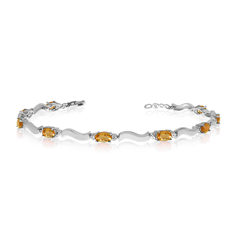 This 10K White Gold oval citrine and diamond bracelet features nine 5x3 mm stunning natural citrine stones with a 2.07 ct total gem weight.