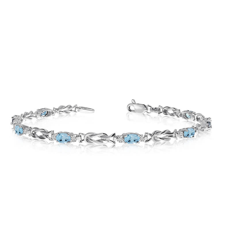 JCX3436: This 10K White Gold oval aquamarine and diamond bracelet features eight 5x3 mm stunning natural aquamarine stones with a 1.6 ct total gem weight.