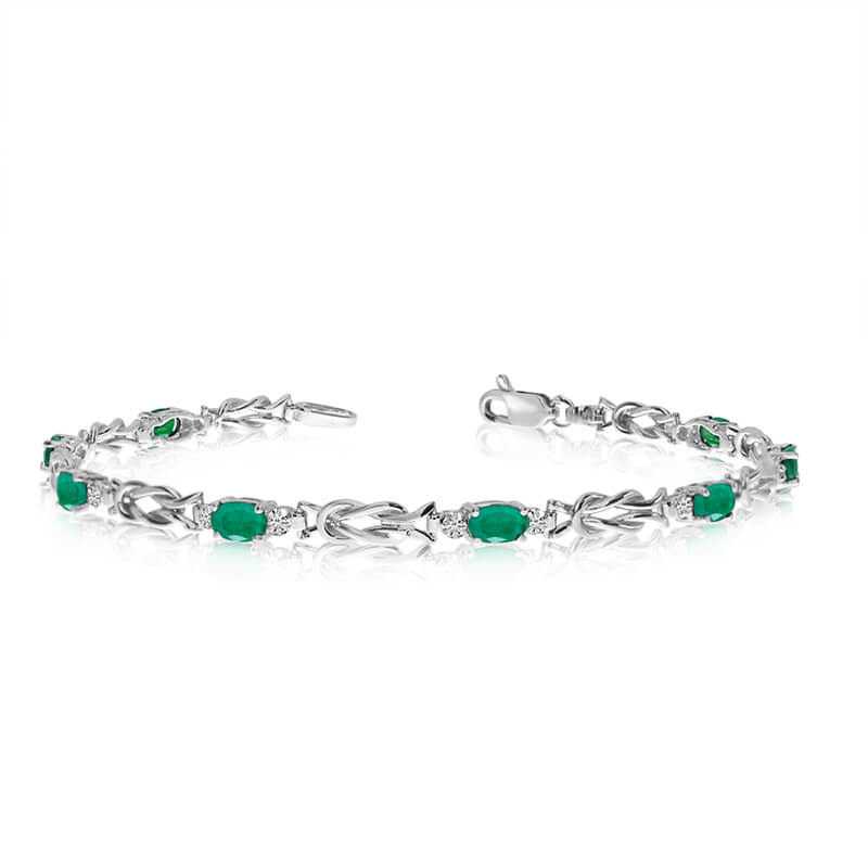 This 10K White Gold oval emerald and diamond bracelet features eight 5x3 mm stunning natural emerald stones with a 2.4 ct total gem weight.