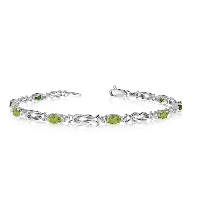 JCX3439: This 10K White Gold oval peridot and diamond bracelet features eight 5x3 mm stunning natural peridot stones with a 2.24 ct total gem weight.