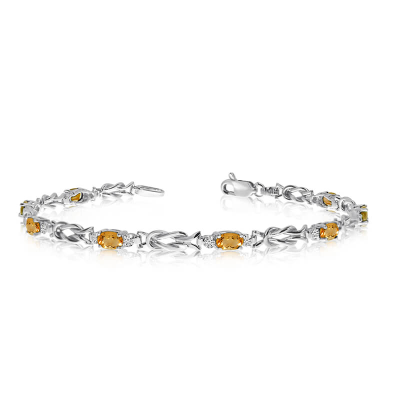 JCX3441: This 10K White Gold oval citrine and diamond bracelet features eight 5x3 mm stunning natural citrine stones with a 1.84 ct total gem weight.