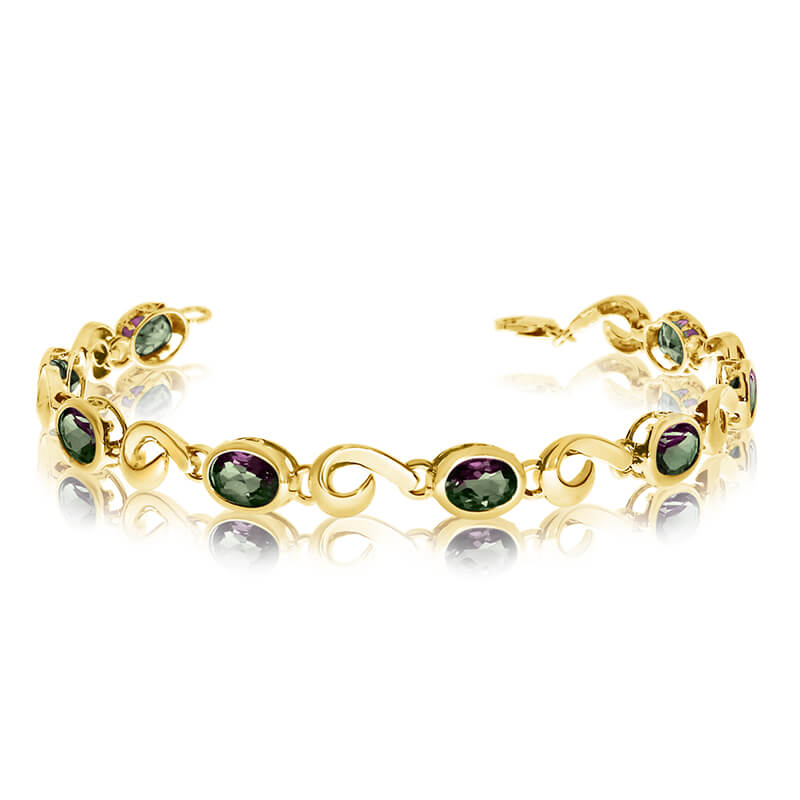 This 14k yellow gold oval mystic topaz bracelet features 8 7x5 mm stunning natural mystic topaz stones with a 5.7 ct total gem weight.