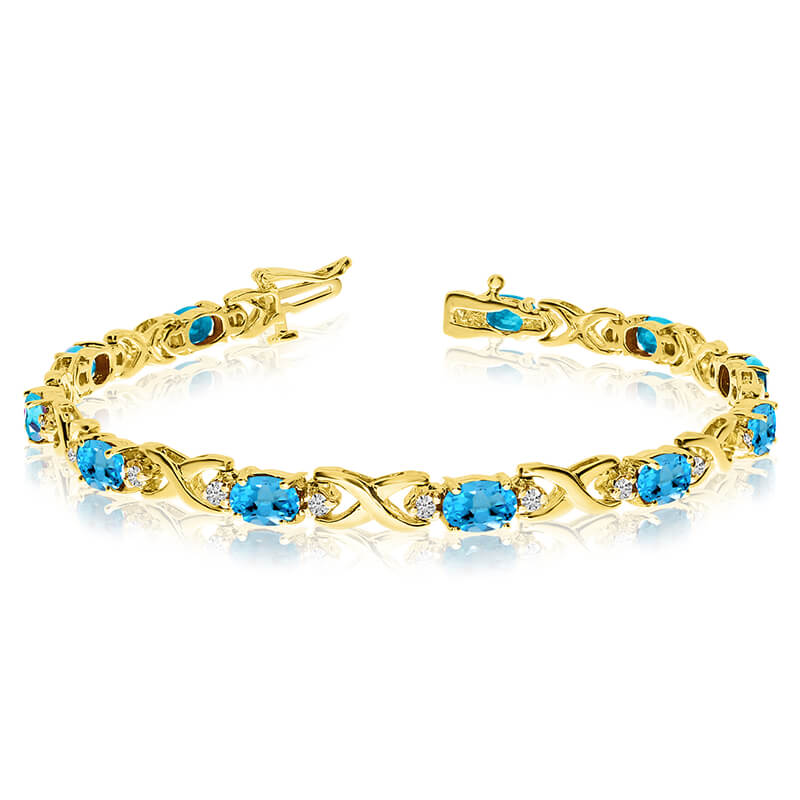 This 14k yellow gold natural blue-topaz and diamond tennis bracelet features 11 oval blue-topazs with a total gem weight of 4.4 carats and a total diamond weight of 0.4 carats.