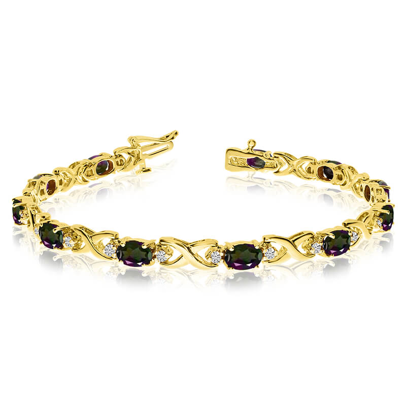 JCX3497: This 14k yellow gold natural mystic topaz and diamond tennis bracelet features 11 oval all natural mystic topaz. and a total diamond weight of 0.4 carats.