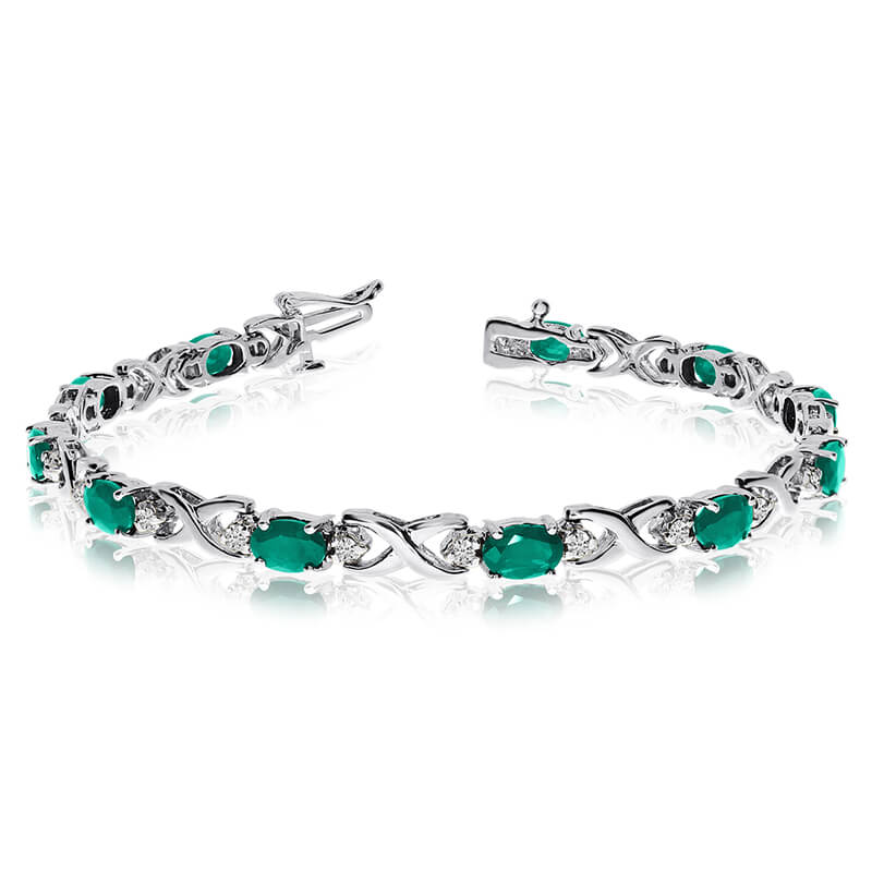 JCX3502: This 14k white gold natural emerald and diamond tennis bracelet features 11 oval emeralds with a total gem weight of 3.41 carats and a total diamond weight of 0.4 carats.