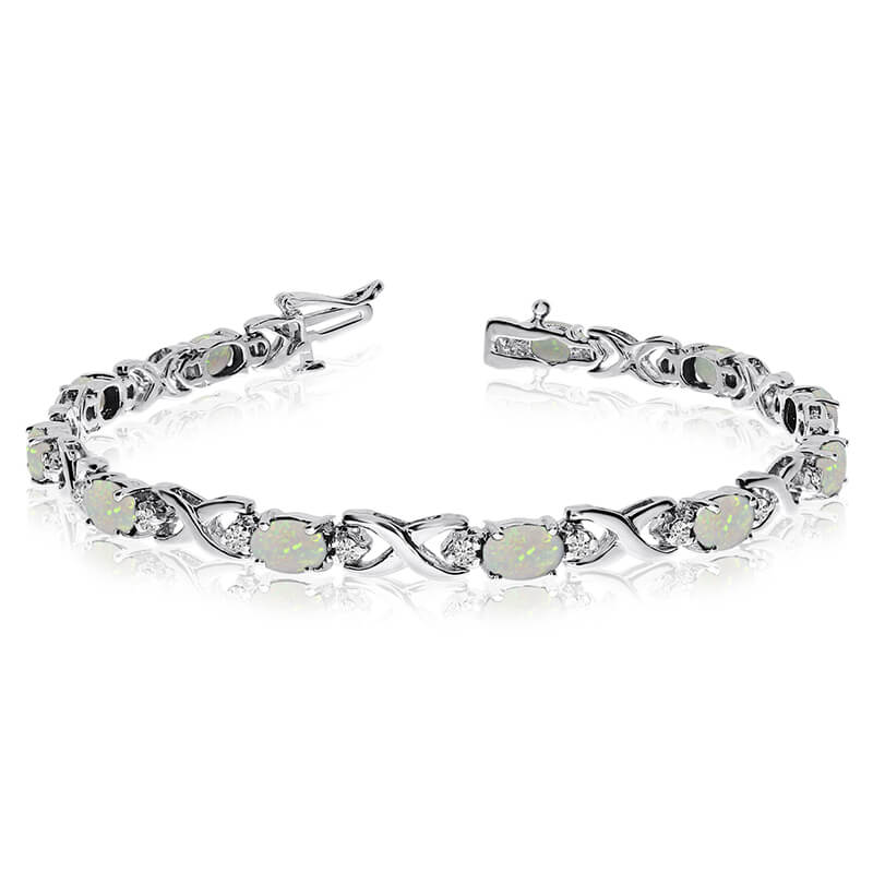 JCX3506: This 14k white gold natural opal and diamond tennis bracelet features 11 oval opals with a total gem weight of 2.09 carats and a total diamond weight of 0.4 carats.