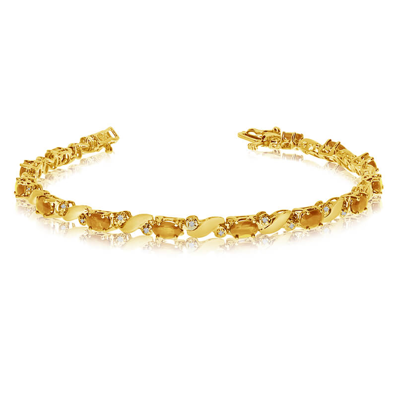 JCX3519: This 14k yellow gold natural citrine and diamond tennis bracelet features 13 oval citrines with a total gem weight of 1.95 carats and a total diamond weight of 0.15 carats.