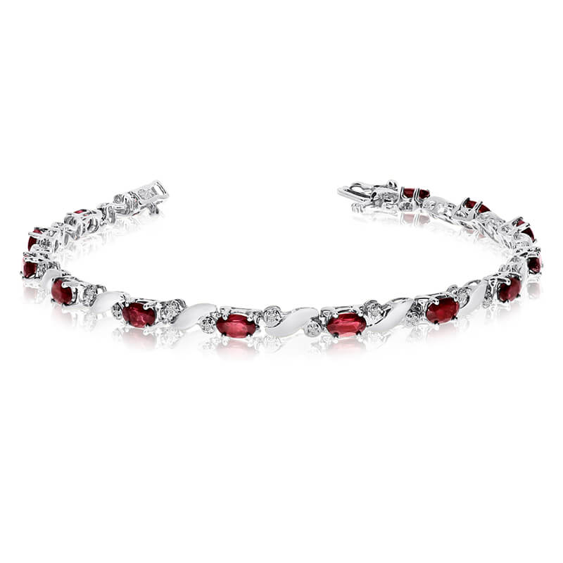 JCX3523: This 14k white gold natural garnet and diamond tennis bracelet features 13 oval garnets with a total gem weight of 2.99 carats and a total diamond weight of 0.15 carats.