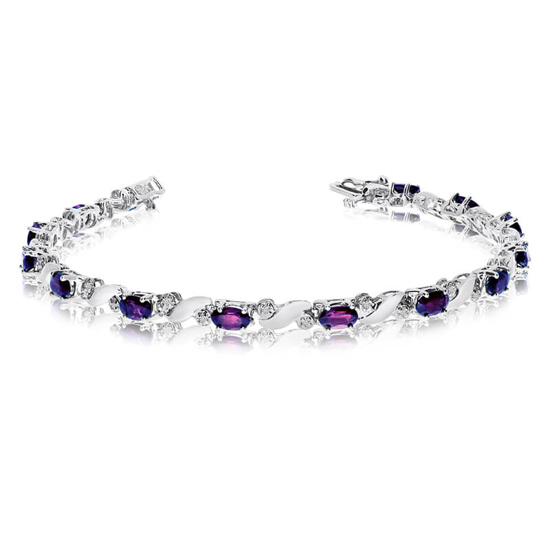This 14k white gold natural amethyst and diamond tennis bracelet features 13 oval amethysts with a total gem weight of 2.34 carats and a total diamond weight of 0.15 carats.