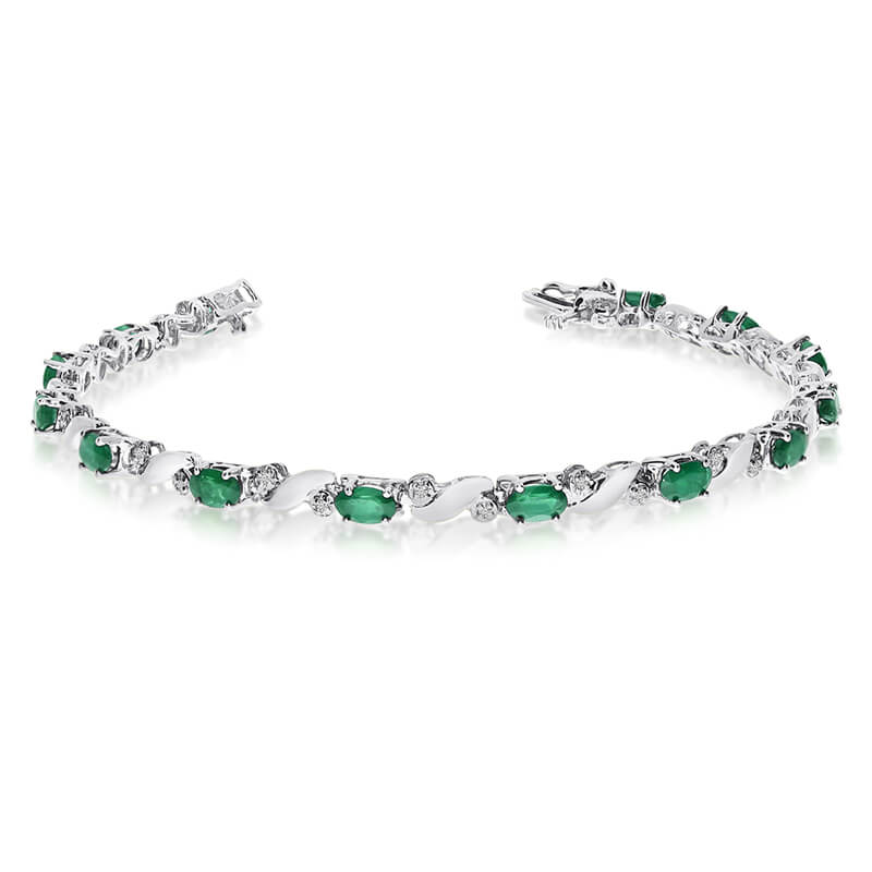 JCX3526: This 14k white gold natural emerald and diamond tennis bracelet features 13 oval emeralds with a total gem weight of 2.08 carats and a total diamond weight of 0.15 carats.