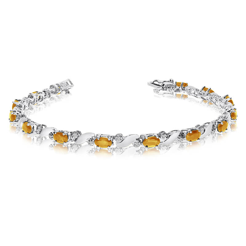 JCX3531: This 14k white gold natural citrine and diamond tennis bracelet features 13 oval citrines with a total gem weight of 1.95 carats and a total diamond weight of 0.15 carats.