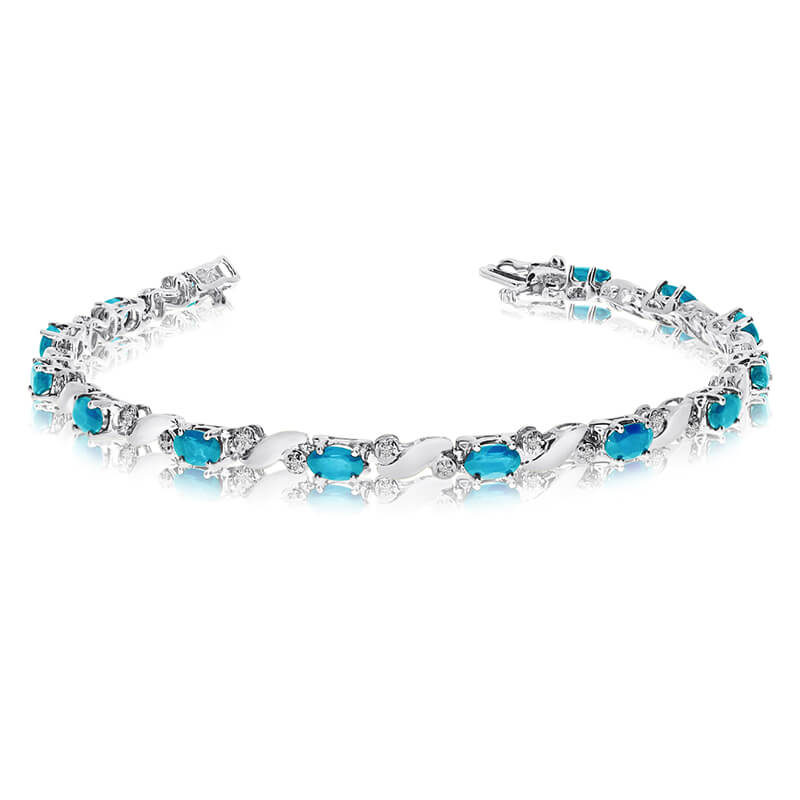 JCX3532: This 14k white gold natural blue-topaz and diamond tennis bracelet features 13 oval blue-topazs with a total gem weight of 2.47 carats and a total diamond weight of 0.15 carats.
