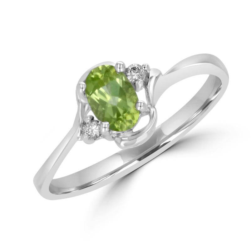 4X6 OVAL PERIDOT AND ONE DIAMOND EACH SIDE RING