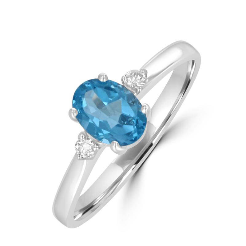 5X7 OVAL BLUE TOPAZ WITH DIAMOND ON EACH SIDE RING