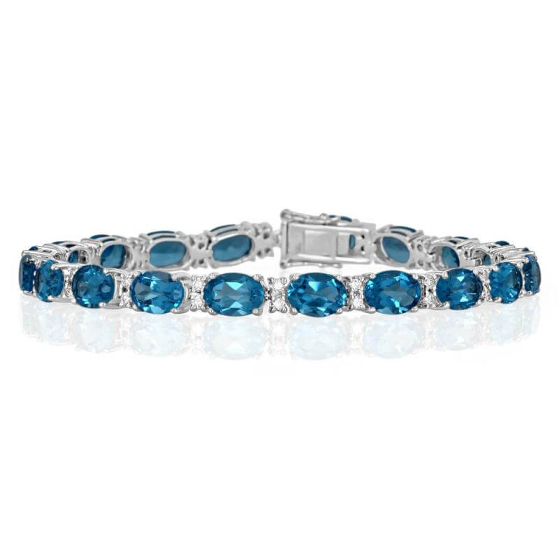 JCX392313: OVAL BLUE TOPAZ AND TWO DIAMONDS BRACELET