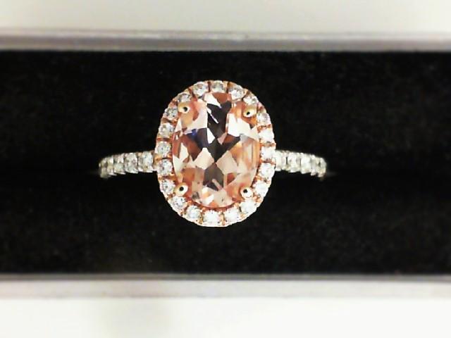 JCSJCS1412: Ladies 14 karat two-tone gold ring with an oval Morganite and round diamonds around the center stone and on each side of the band. 

Size: 6.5