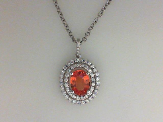 JCSJCS1398: Ladies 18 karat white gold pendant with an oval orange sapphire and two rows of round diamonds around the center stone. This pendant has a 16 in. chain.