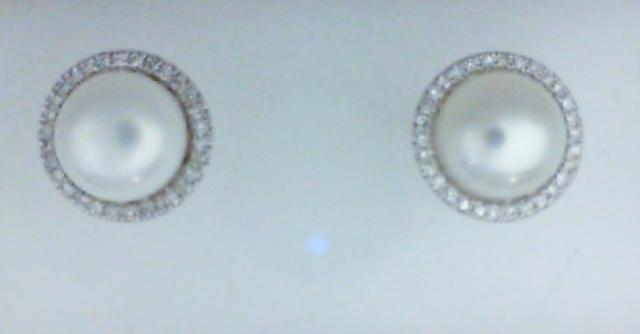JCSJCS1420: Ladies 14 karat white gold pearl earrings with round diamonds around the pearl.