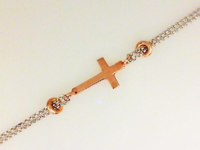 JCSJCS1410: Ladies sterling silver two-tone bracelet with a sideways cross and a double-strand chain.

Length: 7