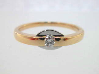 JCSJCS1297: This petite .08CT diamond is mounted with a white gold reflector plate behind it.  This ring could be used a Promise Ring for your Sweetheart or you could wear it as a pinky ring since it has a very flat profile...SOLD