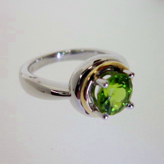 JCSJCS1382: The gemstone Peridot has been known since ancient times. Slaves who mined this gem for the Pharaohs of Egypt were punished for looking at it. You may enjoy this gem without fear.Set in sterling and accented in 18kt gold. SOLD