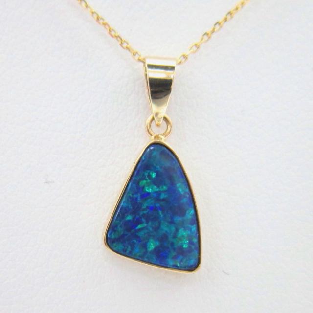 JCSJCS1383: This is a doublet of a high quality blue green Opal and natural ironstone giving the appearance of a fine boulder opal. Set in 14kt yellow gold....SOLD
