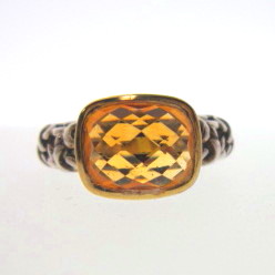 JCSJCS1503: A brilliant checkerboard cut Citrine gemstone is mounted in a designer style sterling silver ring with a yellow vermeil bezel for the stone. SOLD