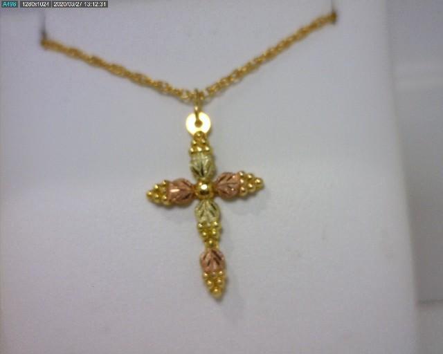Always good prices in our Estate Case, including this pretty Black Hills Gold 12kt Cross necklace...